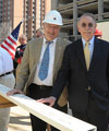 UofL and Messer officials sign top beam